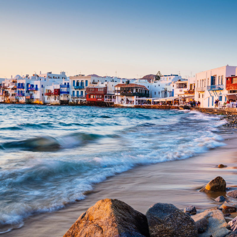Rolling waves and sunset dining at fmaous Mykonos neighborhood of Little Venice, Mykonos, Greece